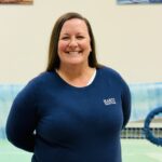 Smiling woman in blue sweater