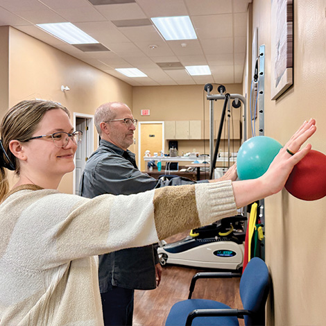 PTA student doing wall exercise with patient
