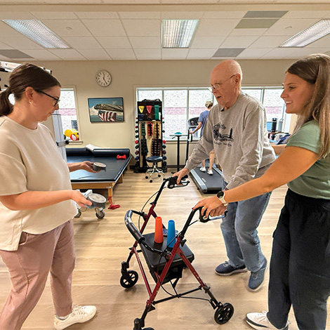 PT student working with neuro patient on walking