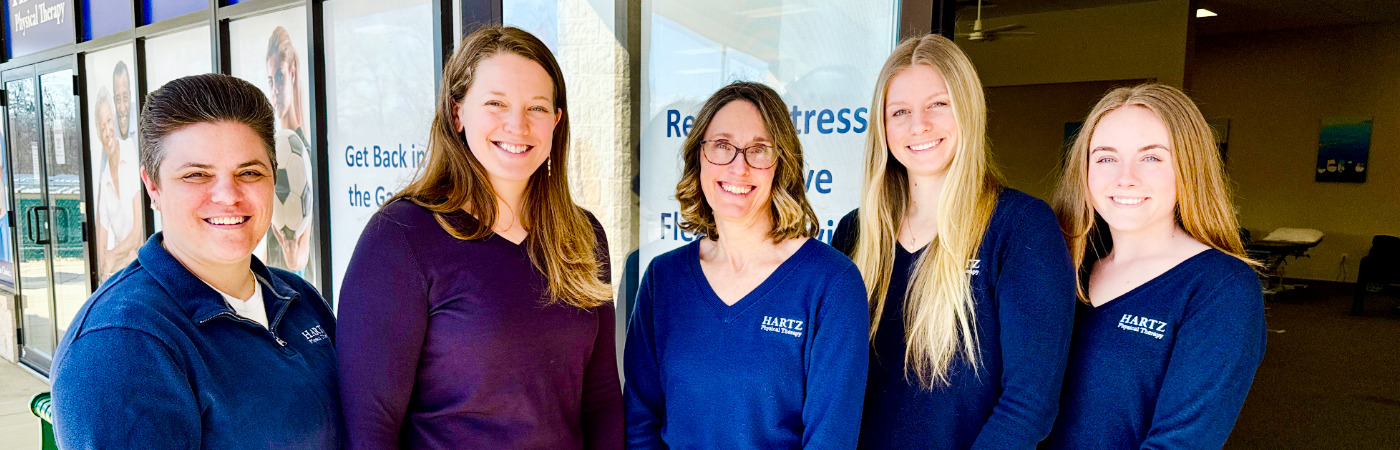 Group of women in matching outfits.
