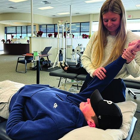 woman stretching boys arm