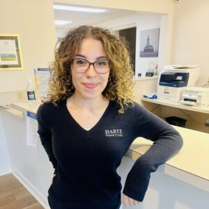 Woman in office with curly hair