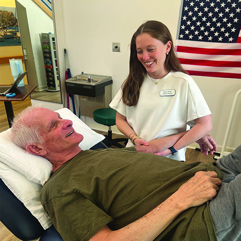 girl smiling at older male patient