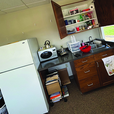 neat kitchen with refrigerator