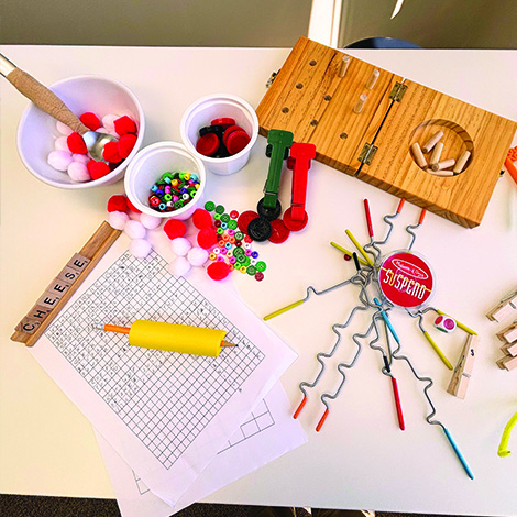 table with items for handwriting and fine motor skills