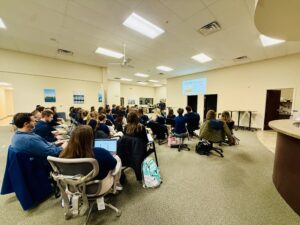 Students attending a presentation in classroom