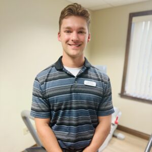 Smiling man in striped polo shirt