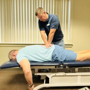 Man receiving chiropractic treatment