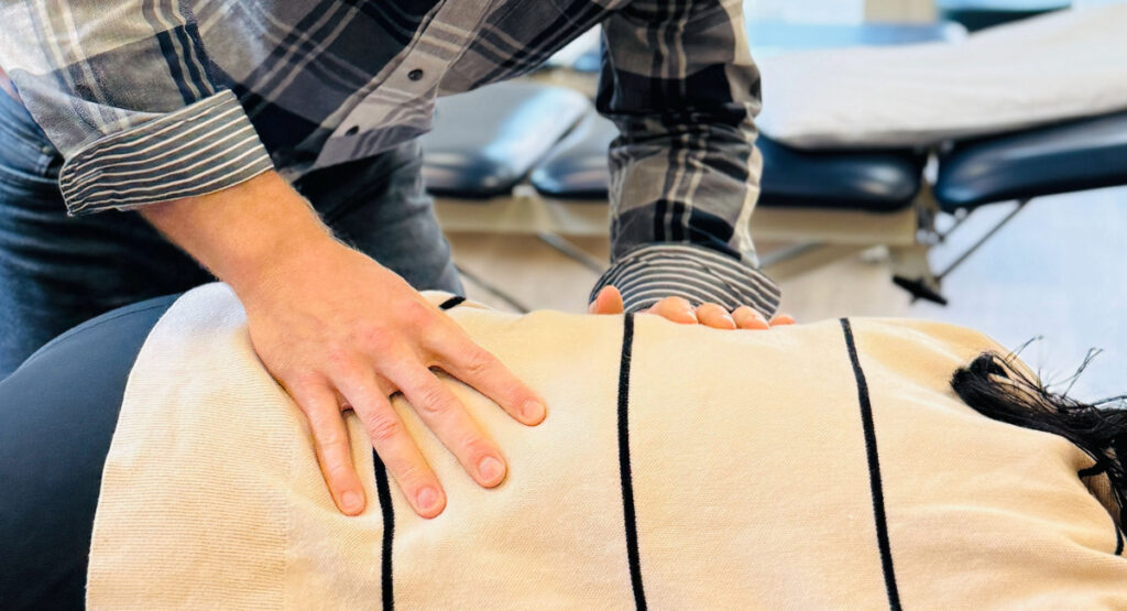 Person receiving manual therapy treatment